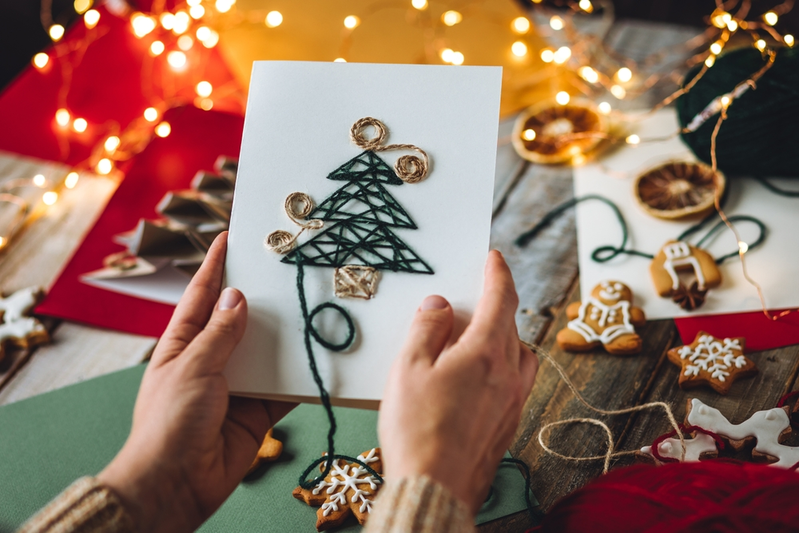 person holding a Christmas card